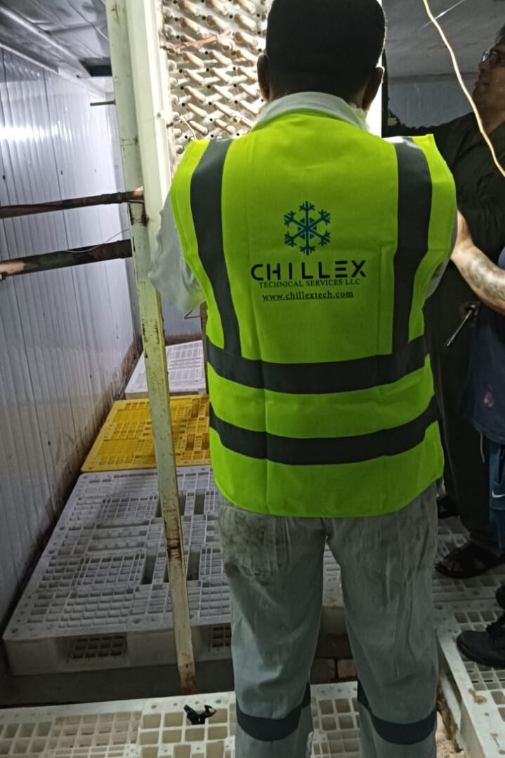 Chillex engineer servicing a cold room evaporator coil under a maintenance contract