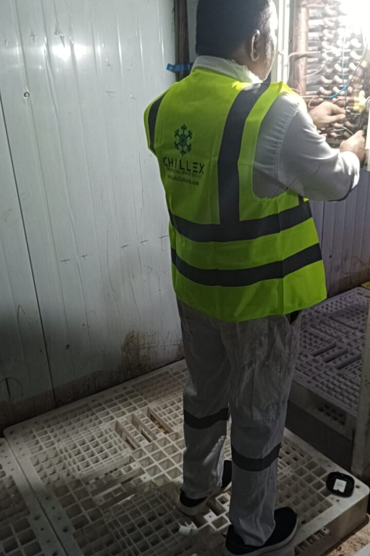 Chillex technician carrying out a scheduled preventive maintenance visit inside a cold storage room
