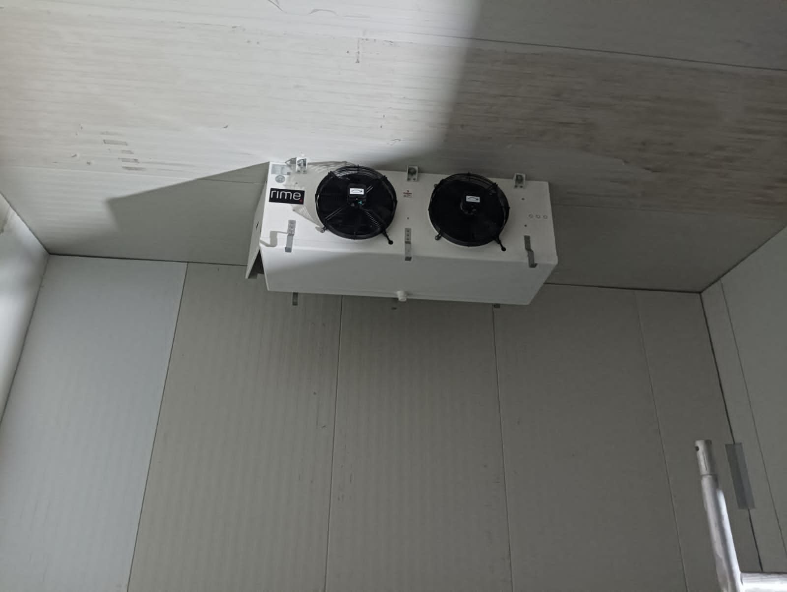 Twin-fan unit cooler installed in a completed insulated cold room