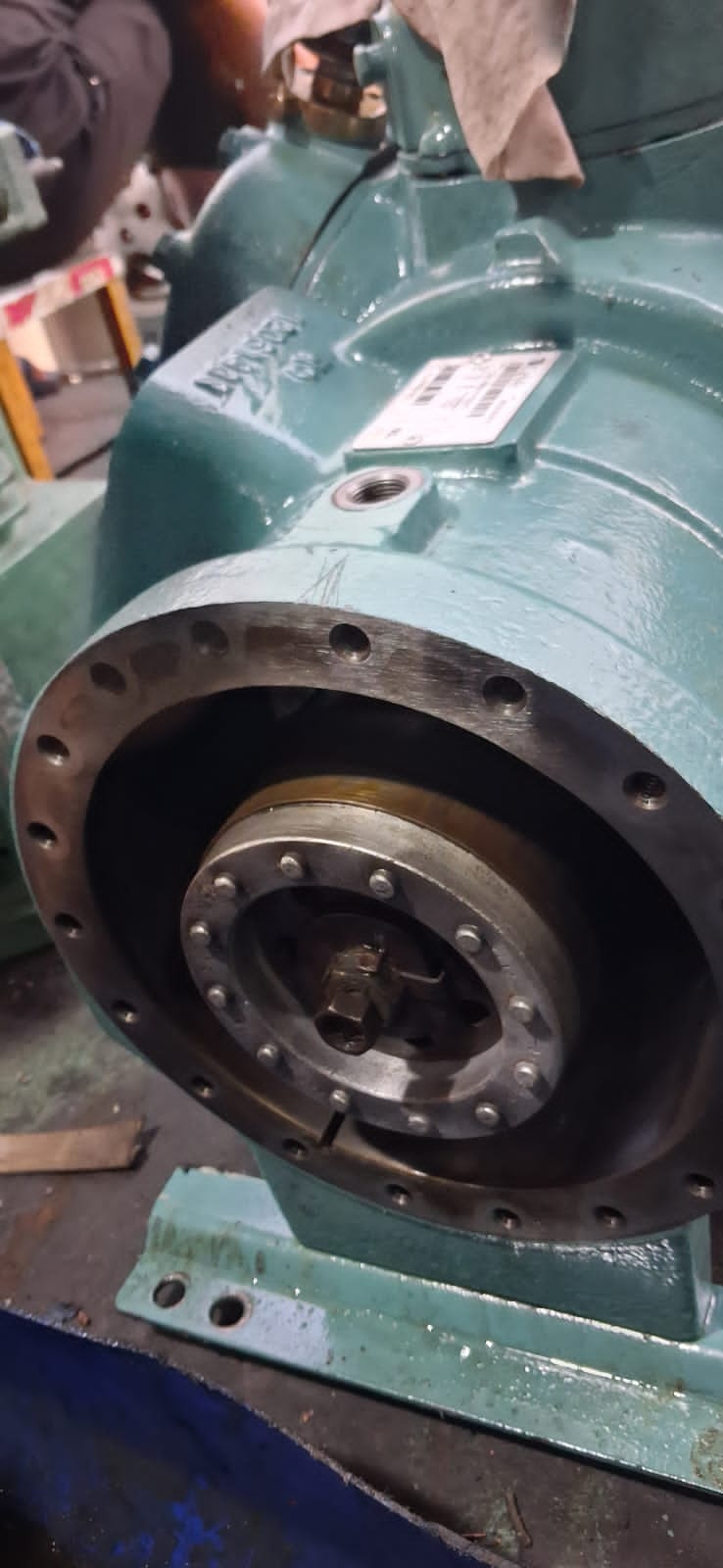 Compressor end cover removed exposing the crankshaft and bearing housing flange