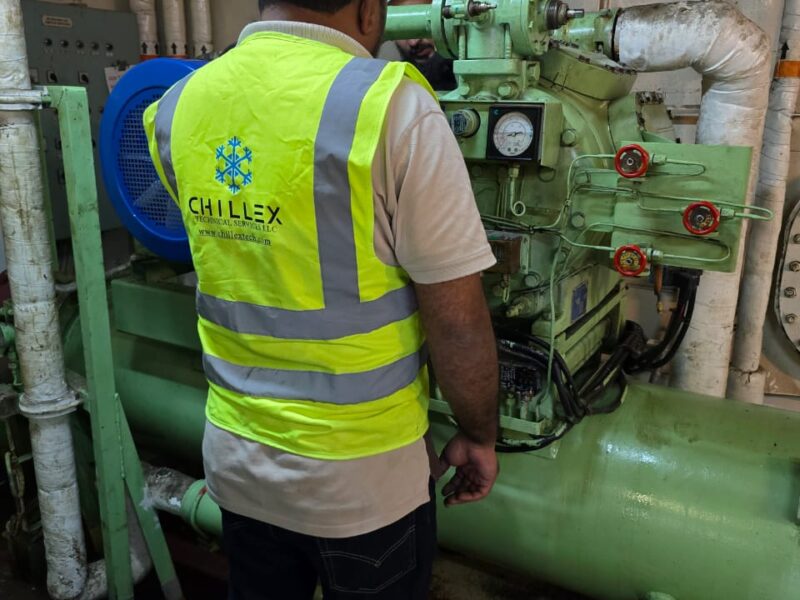 Two Chillex engineers carrying out preventive maintenance on a vessel's refrigeration plant