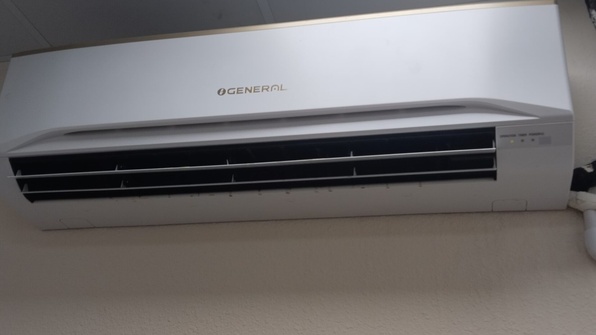 High wall split air conditioning indoor unit installed to a clean commercial finish in Dubai